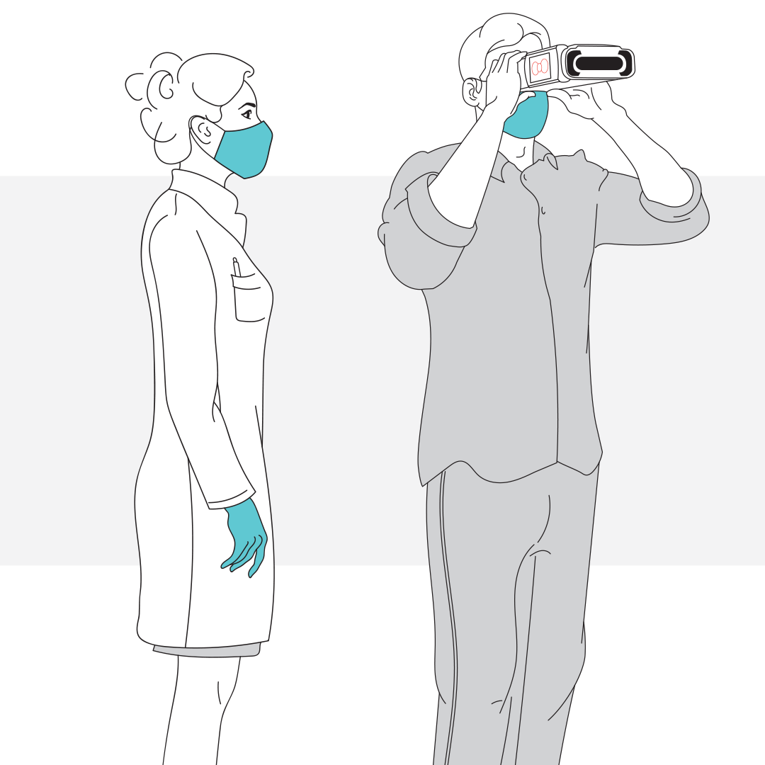 Doctor standing at right shoulder of patient using QuickSee