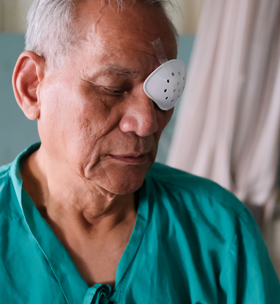 Man with eye patch after cataract surgery
