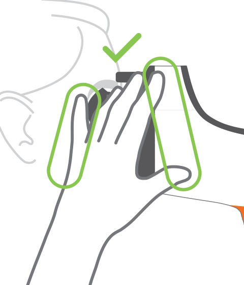 Illustration showing how to steady the device with the operator's off hand, by bridging it to the patient's temple.