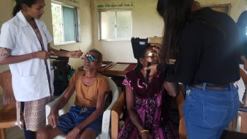Patients getting eye exams in rural India