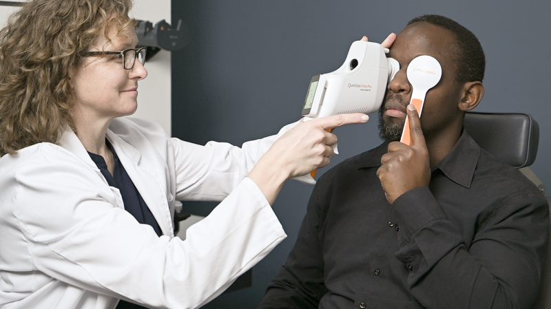 Optometrist measuring a man with QuickSee Free Pro